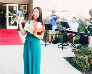 Souvenirs from my visit to Oldenborg Center! (pictured: Pomona College Jazz Trio, postcards from Germany, a placard with my name written in Arabic, a paper flower from Spanish lounge)