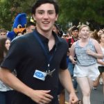 Bryce running with his classmates through the gates, beginning of his first year