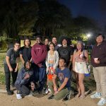 group of students outside at night