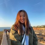 Hayeon outside with blue sky behind