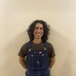 Claudio Castillo in front of blank wall
