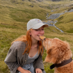 Emma and her dog sharing a cookie
