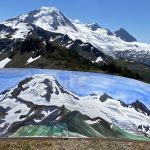 Emma Grace holding painting of mountains in front of mountains